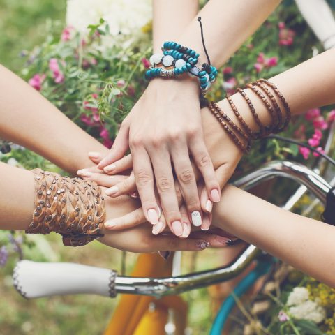 Women's hands joined together