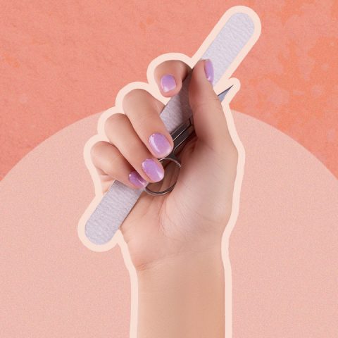 hand with nail supplies