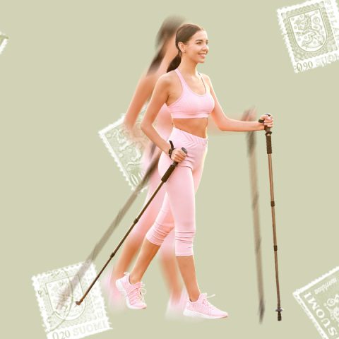 Woman using walking sticks for nordic walking