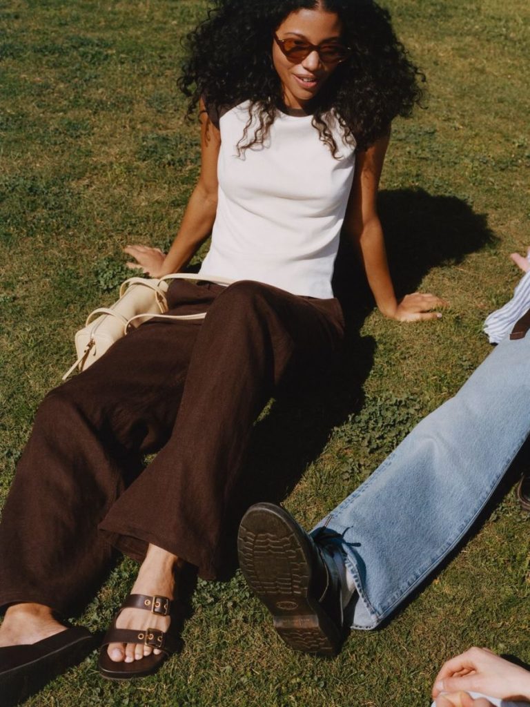 brown pants and white tank