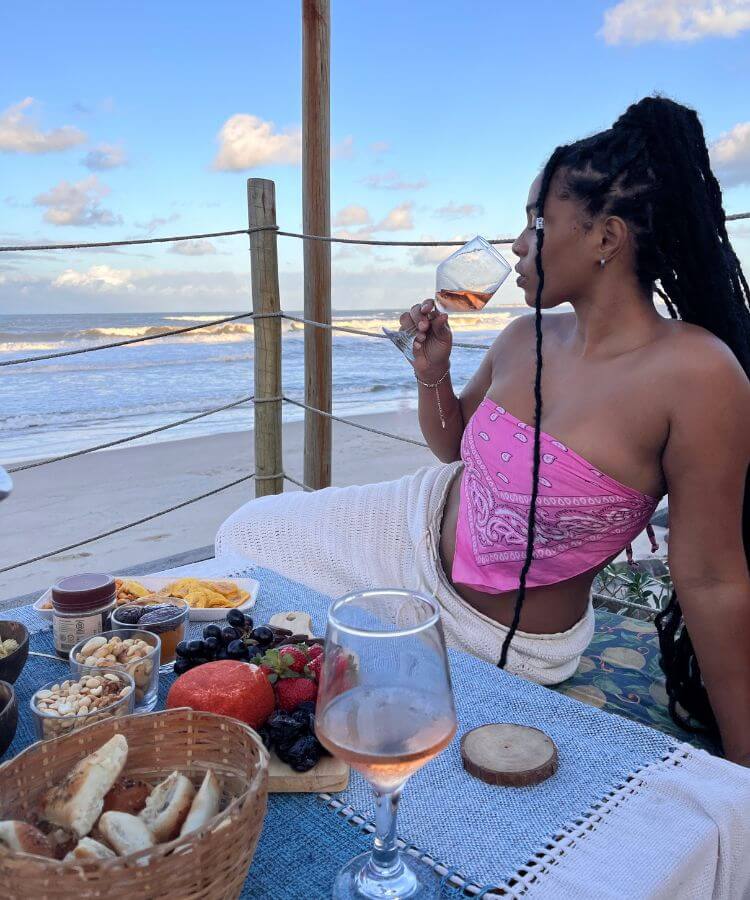 woman sipping wine on vacation