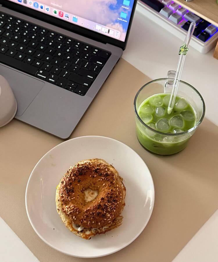 Portfolio Career setup with laptop bagel and matcha